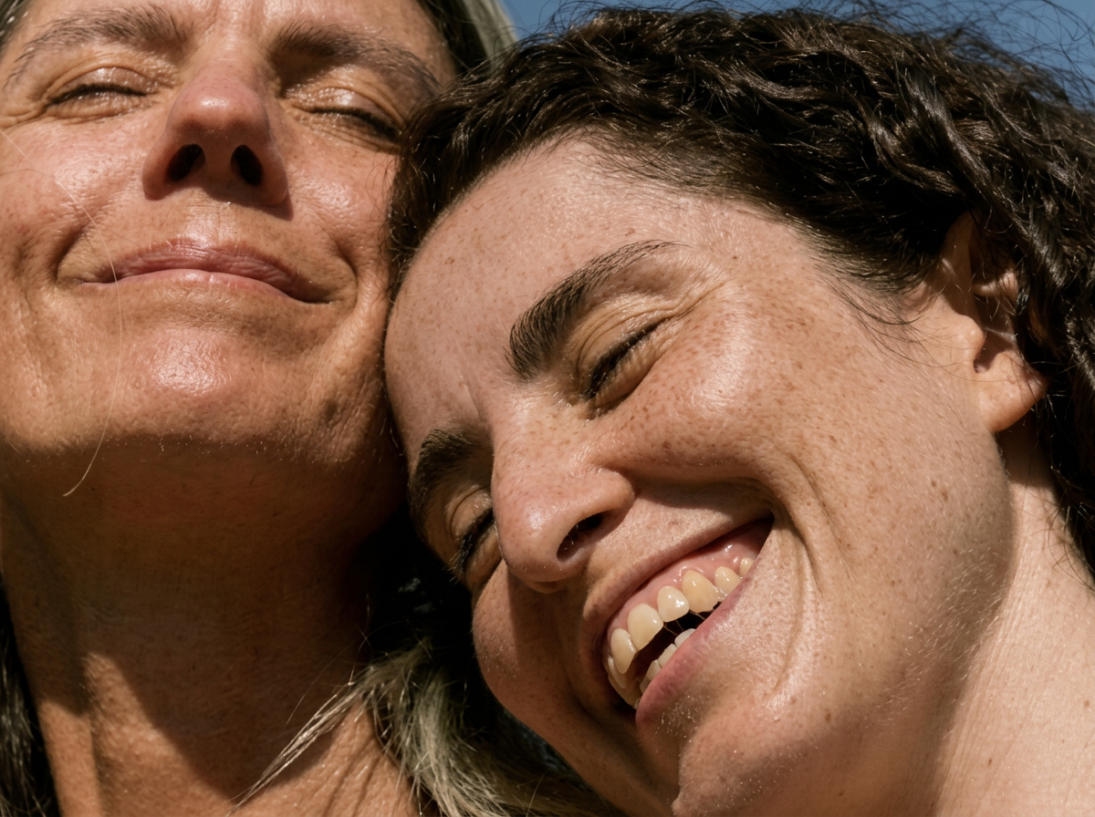 Sunlit close-up of a smiling couple