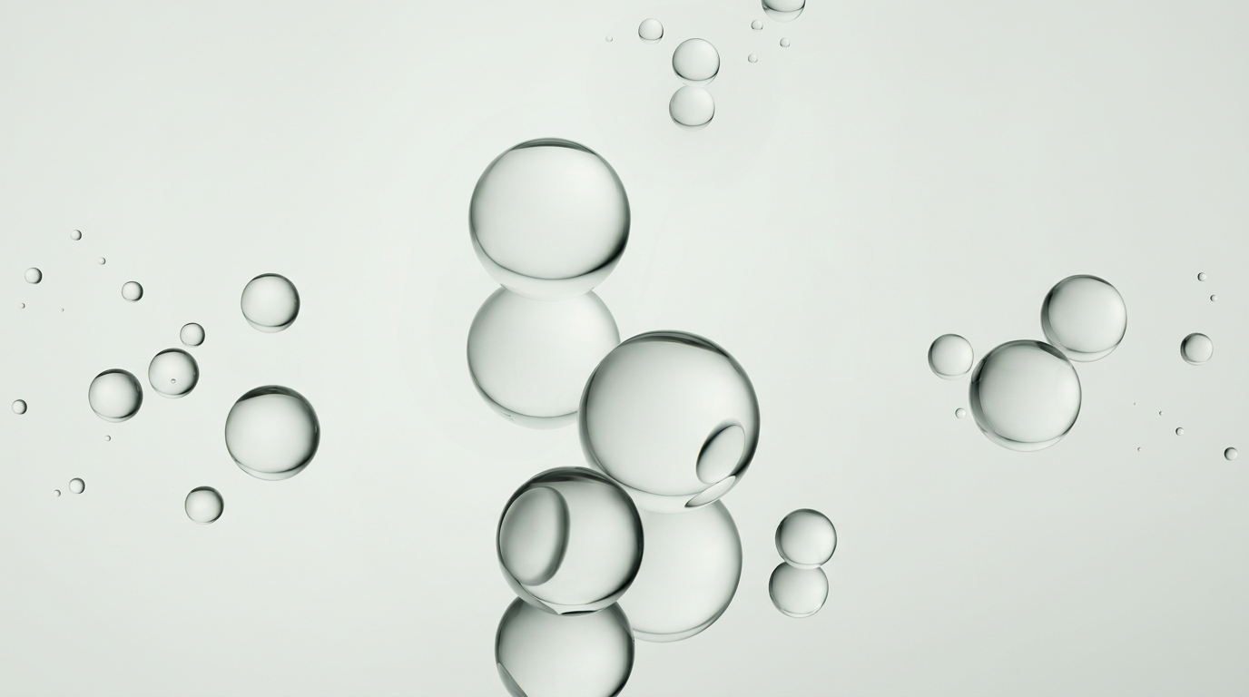 Abstract close-up of clear liquid droplets suspended in liquid